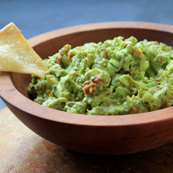Basil and Sun-Dried Tomato Guacamole with Parmesan Tortilla Chips