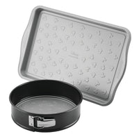 Two metal baking pans, one rectangular, one round with a latch.