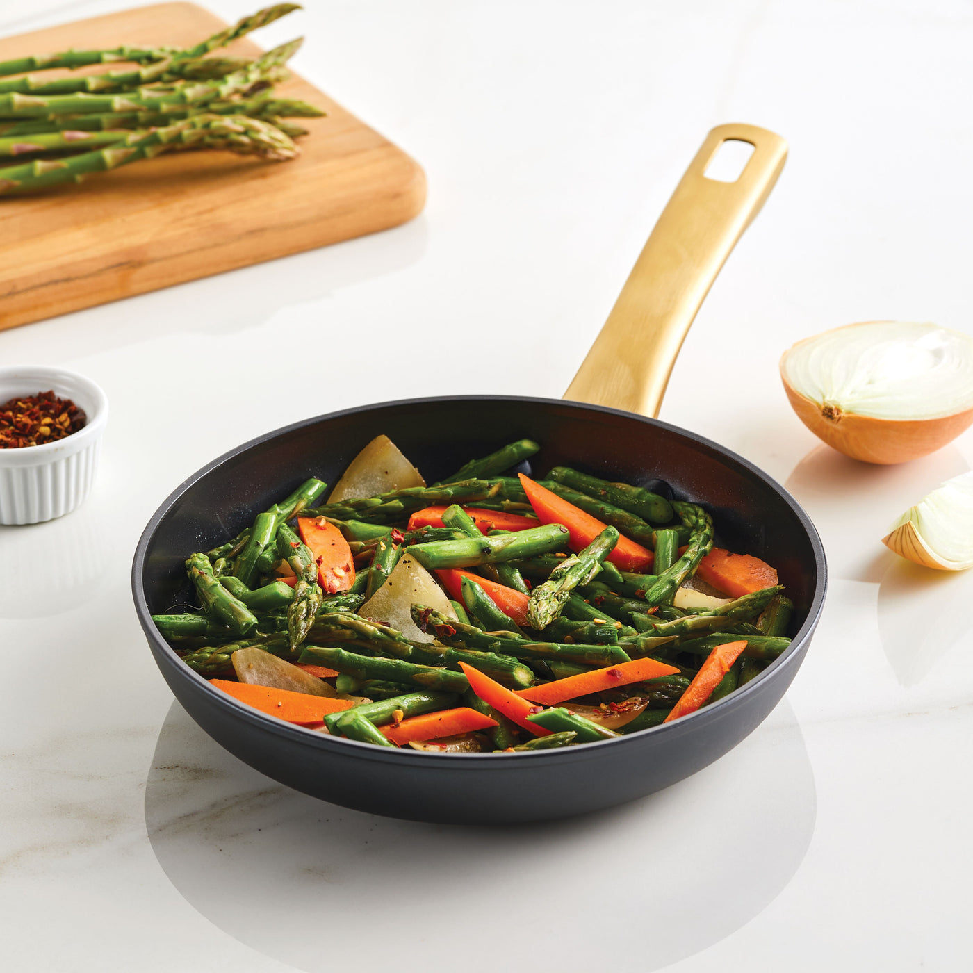 Cooked asparagus, carrots, and potatoes in a Forged Induction Ceramic 8.25-Inch Frying Pan.