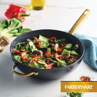 Stir-fry vegetables in the 12.25-Inch Stir-Fry Pan with Helper Handle on the counter.