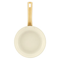 A top-down view of the Forged Induction 8.25-Inch Frying Pan's interior, featuring a smooth, cream-colored nonstick surface. The long, gold-tone handle is positioned vertically at the top, showing the double-rivet attachment and the signature hollow-center design with a hanging hole.