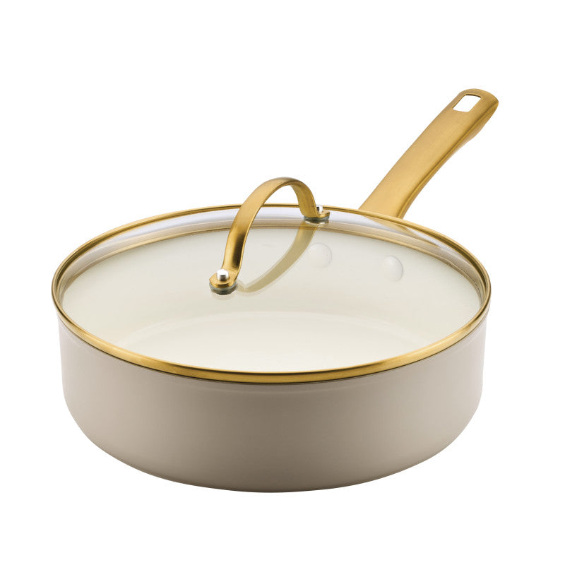 Cream-colored 3-qt forged saute pan with gold handle; induction-ready nonstick.