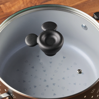 Monochrome ceramic nonstick stockpot lid with a whimsical Mickey Mouse-shaped handle, perfect for adding a touch of magic to your 5.5-quart stockpot.