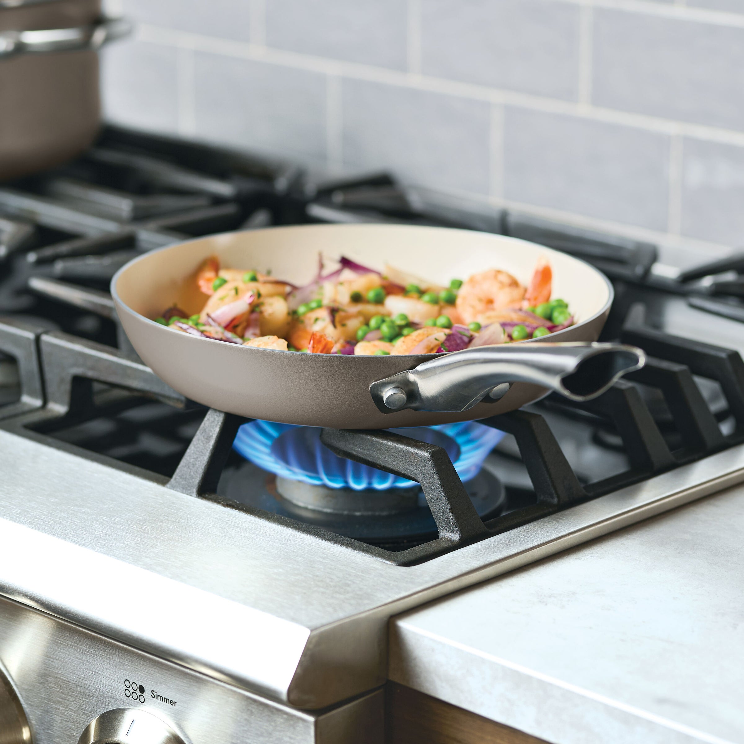 Shrimp and veggies cook in a Ceramic Nonstick Frying Pan Twin Pack on a stove.