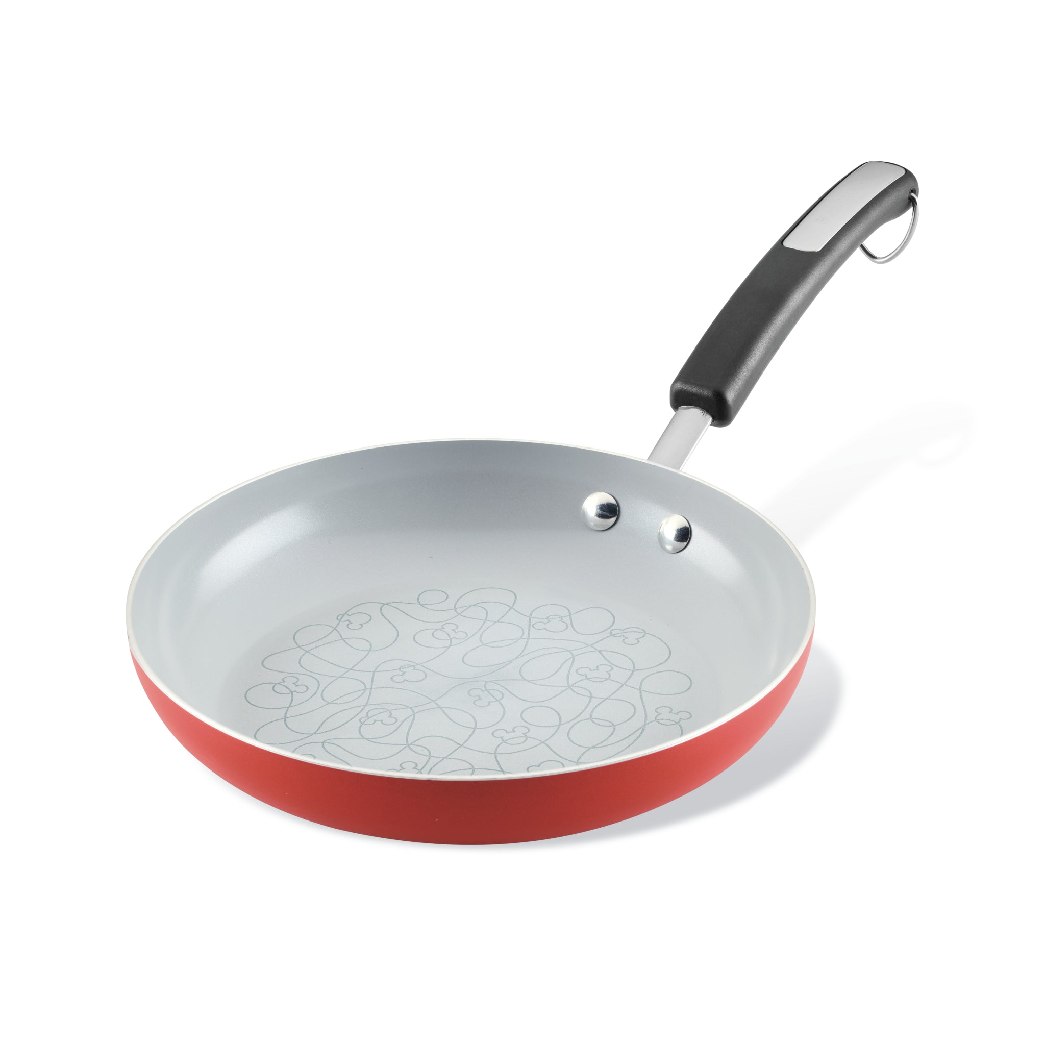 The Bon Voyage Ceramic Nonstick Frying Pan, featuring a red and gray design with a decorative interior pattern, is perfect for those who love ceramic nonstick cookware.
