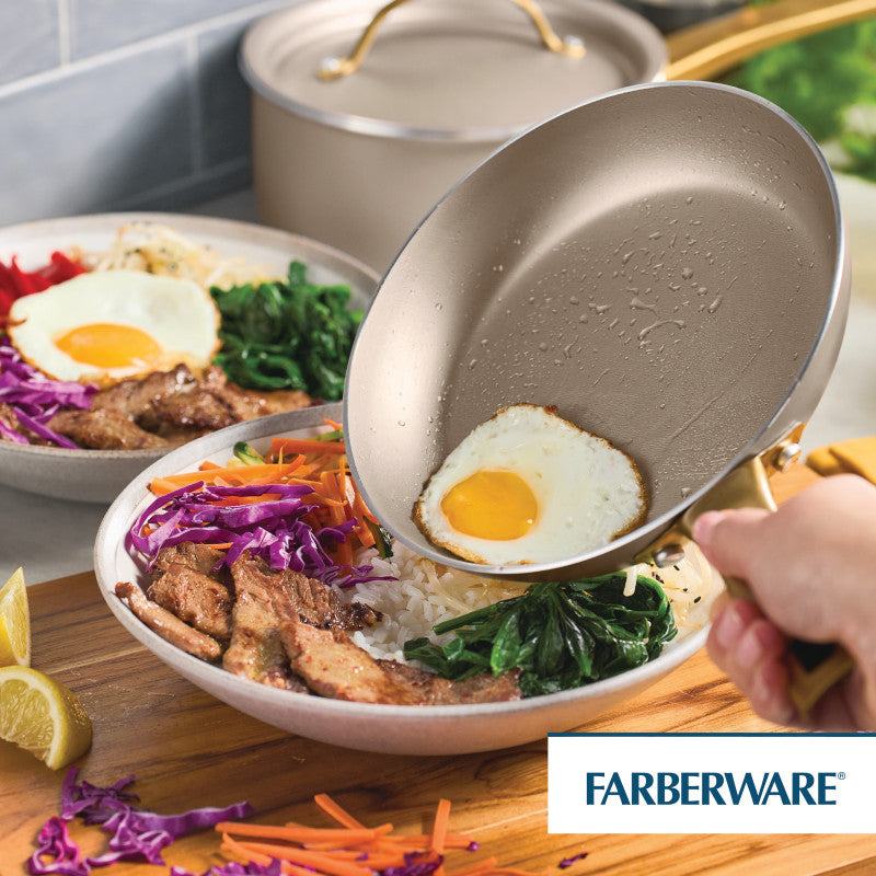 Rice and veggies are topped with a fried egg from a 10-Inch Nonstick Frying Pan.