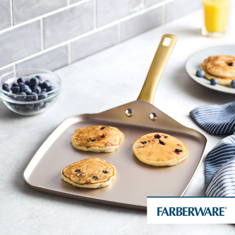 Three blueberry pancakes cooking on an 11-Inch Square Griddle Pan, Champagne.