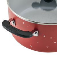 The Bon Voyage 5.5-Quart Ceramic Nonstick Stockpot with Lid, adorned in a vibrant red with black handles and a clear lid, showcases an enchanting Mickey Mouse design. It's the perfect addition to bring a touch of magic to your ceramic nonstick cookware collection.