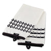 Add a touch of Disney Home Monochrome style with these kitchen towels, featuring two white pieces with black geometric patterns and tags.