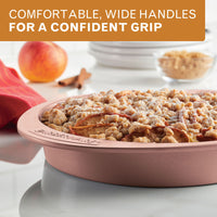 Comfortable, wide handles for a confident grip: rose gold round cake pan of apple crumble