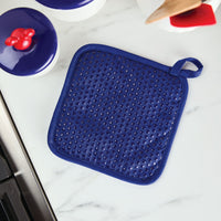 As a member of the Bon Voyage collection, the Bon Voyage Pot Holder brings a vibrant splash of blue to complement your white marble kitchen countertop.