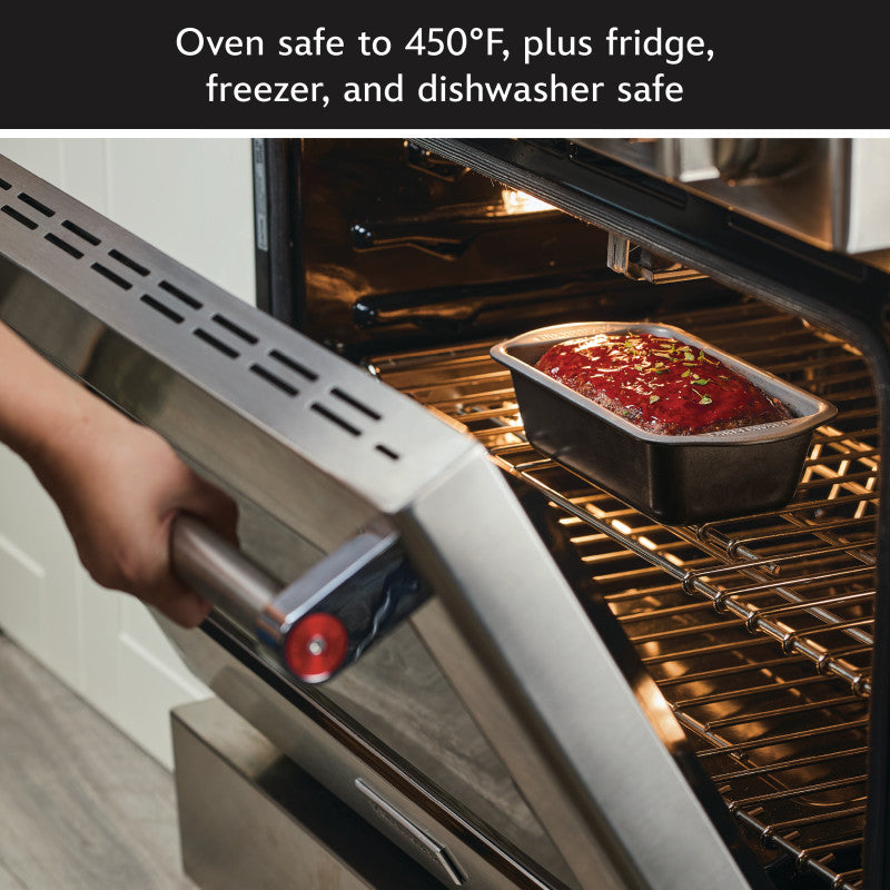 Someone puts a loaf pan from a 6-Piece Bakeware Set into an open oven.