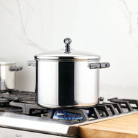 The Classic Series Stainless Steel Stockpot with Lid, when used on a gas stove with a blue flame, guarantees long-lasting performance and exceptional durability.