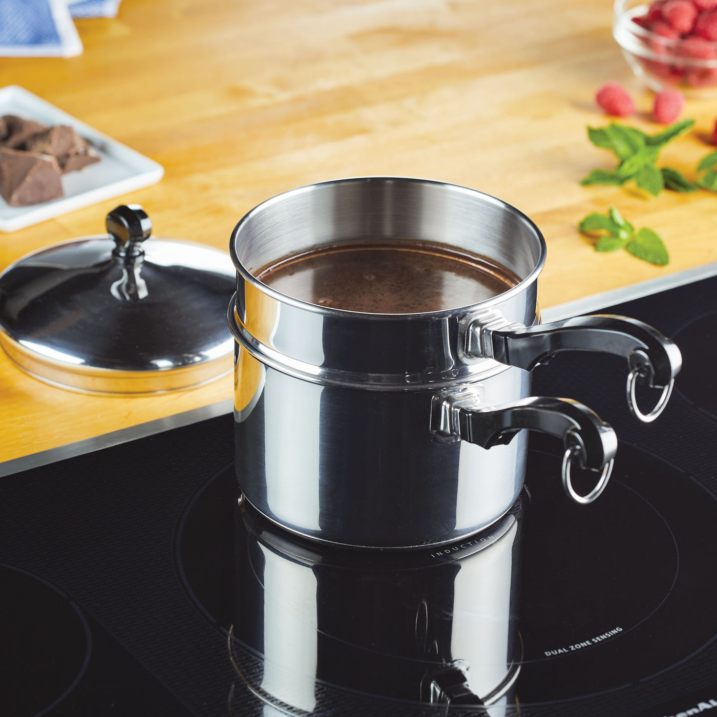The 2-Quart Double Boiler Saucepan with Lid sat on the stovetop as chocolate melted gently within it.