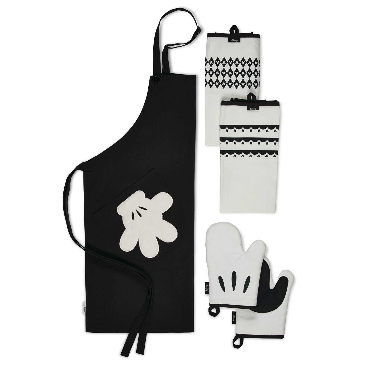 The Monochrome 5-Piece Set includes a black apron, two white mitts, and three black and white patterned towels. Perfect for fans, this collection brings a hint of Mickey Mouse magic to your culinary adventures.