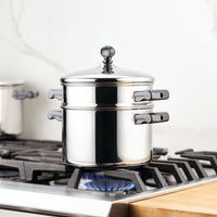 Stainless steel pot on a gas stove with blue flame visible.