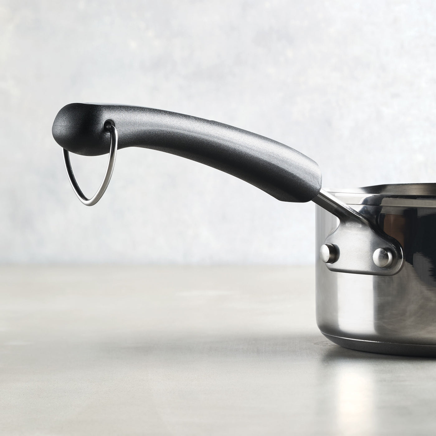 Perfect for everyday cooking, the 1-Quart Stainless Steel Saucepan comes with a stylish black handle and a handy hanging ring.