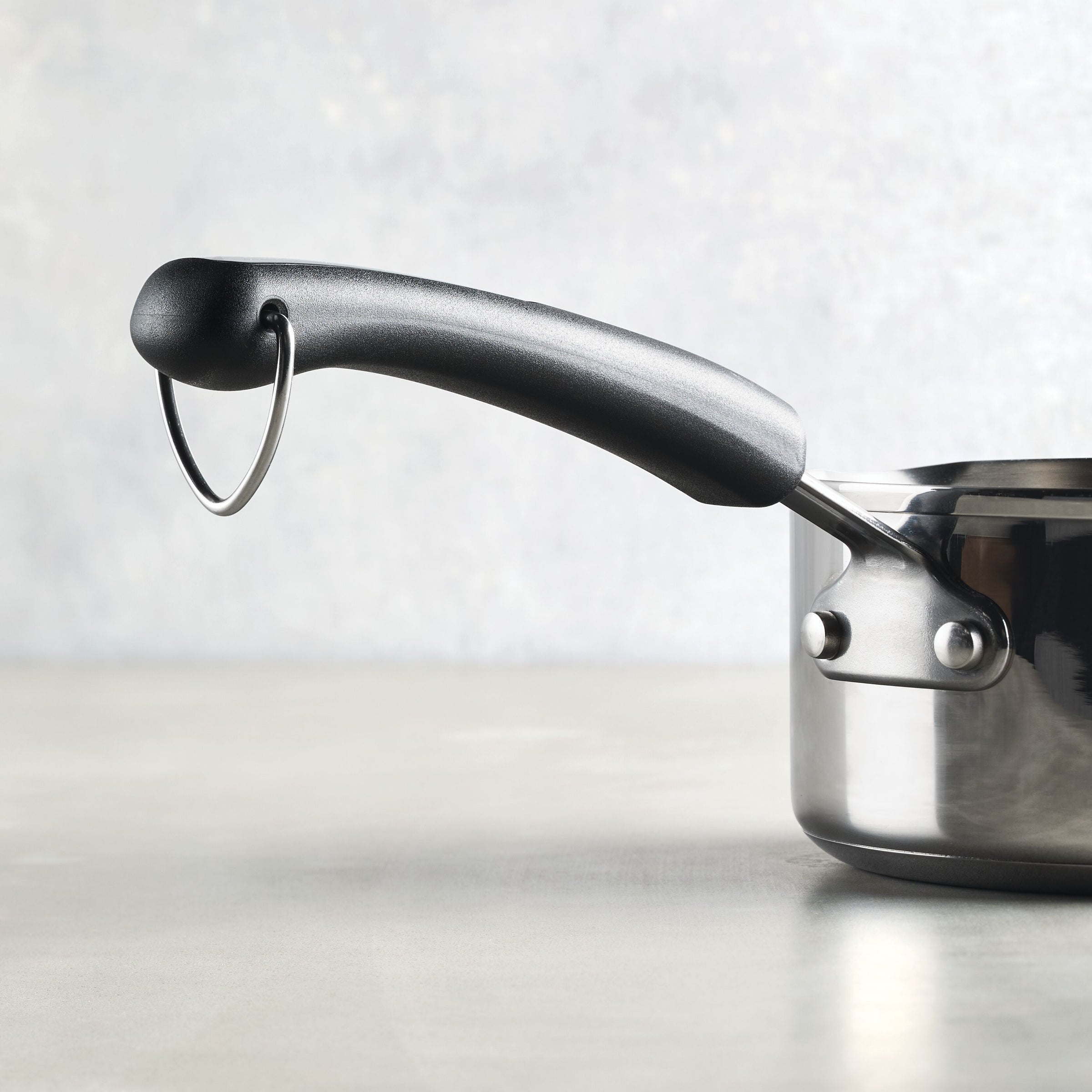 Perfect for everyday cooking, the 1-Quart Stainless Steel Saucepan comes with a stylish black handle and a handy hanging ring.