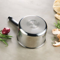 The 3-Quart Stainless Steel Saucepan rests elegantly on the table, surrounded by fresh vegetables and a cozy cloth, ready to inspire your next culinary creation.