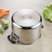 An 8-Quart Stainless Steel Stockpot upside down near fresh vegetables.