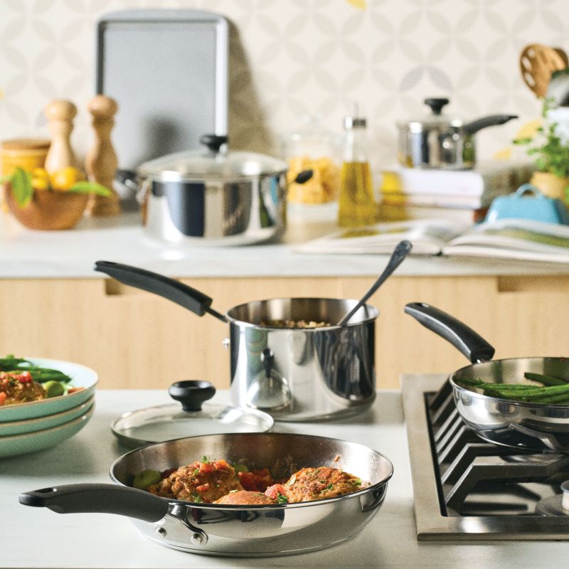 A kitchen counter with a 14-Piece Stainless Steel Cookware Set for daily use.