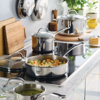 Millennium Stainless Steel 10-Piece Cookware Set in use on a modern stovetop.