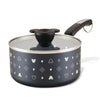 The 2-Quart Monochrome Ceramic Nonstick Saucepan with Lid features a distinctive patterned design and a glass lid with a uniquely crafted handle, seamlessly blending function with flair.