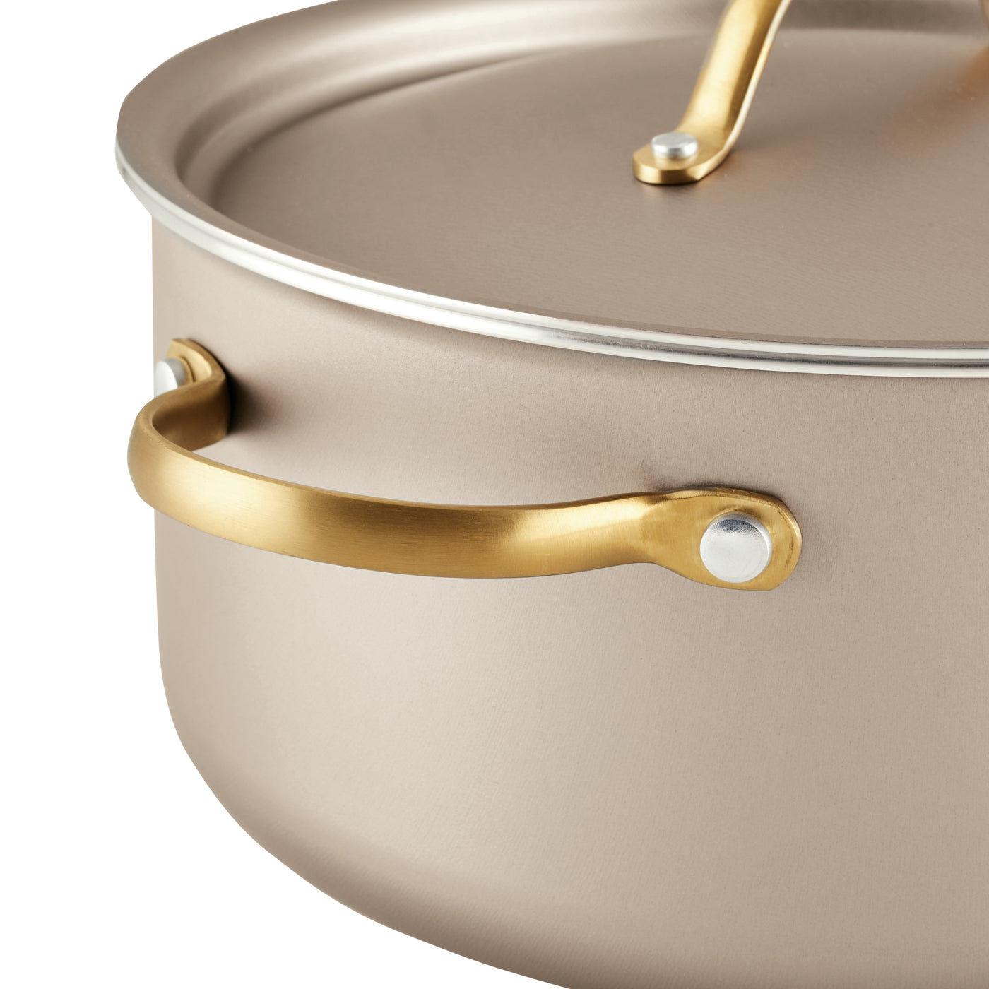 The Radiant Nonstick 5.5-Quart Dutch Oven With Lid in beige boasts a gold-colored handle and ensures excellent heat distribution for optimal cooking results.