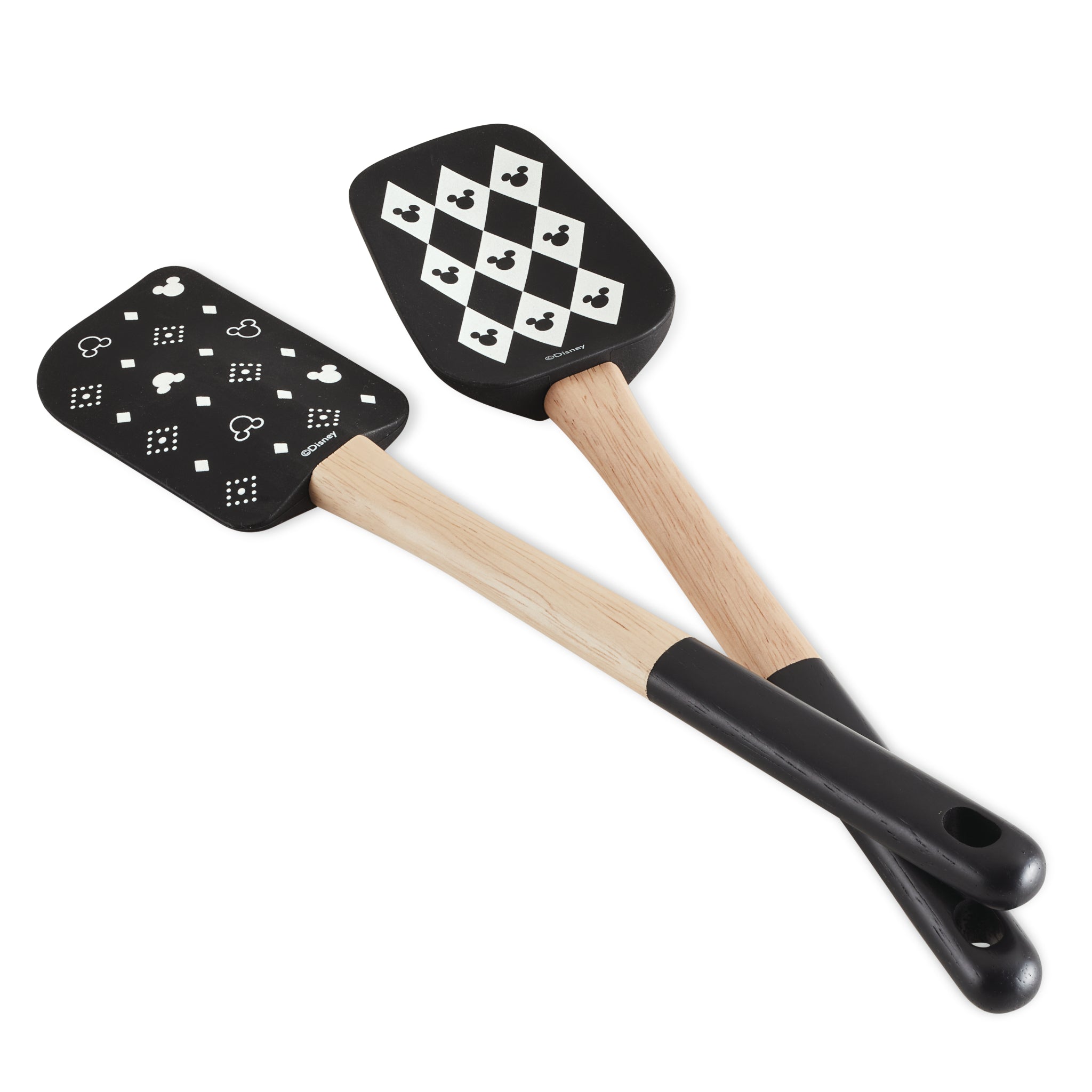 A set of two black silicone spatulas with wooden handles featuring geometric patterns, ideal for a Disney Home Monochrome kitchen, from the 2-Piece Spatula and Spoonula Set.