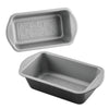 Two gray nonstick loaf pans with Mickey Mouse embossing on the base.