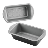 Two gray nonstick loaf pans with Mickey Mouse embossing on the base.