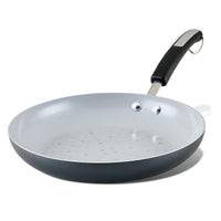 The Monochrome Ceramic Nonstick Frying Pan features a sleek black handle beautifully contrasting with its clean white design.