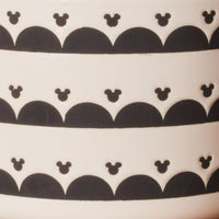 The Ceramic Jar with Airtight Lid showcases black patterns of Disney's Mickey Mouse on a clean white background, ensuring your contents stay fresh.