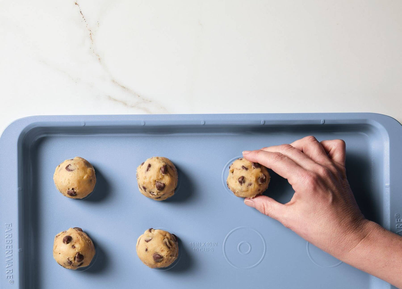 Placing cookie dough with Easy Solutions bakeware guides