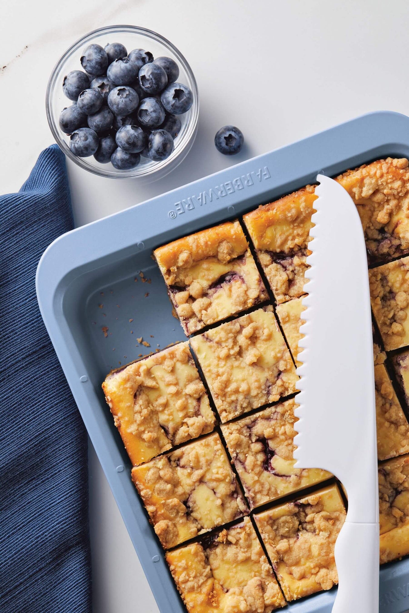 Slicing blueberry crumble bake with Easy Solutions cutting guide product