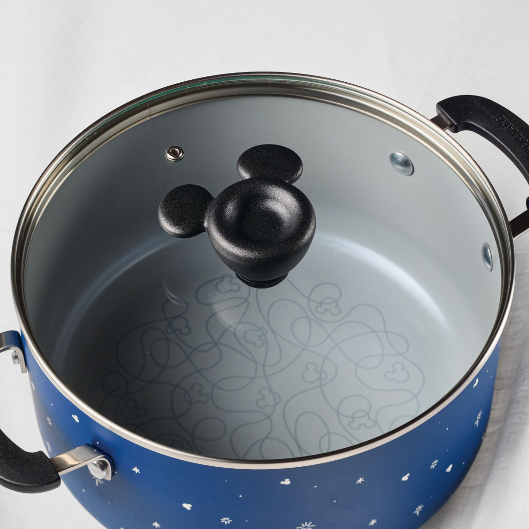 Blue pot with a decorative lid featuring a mouse-shaped handle.