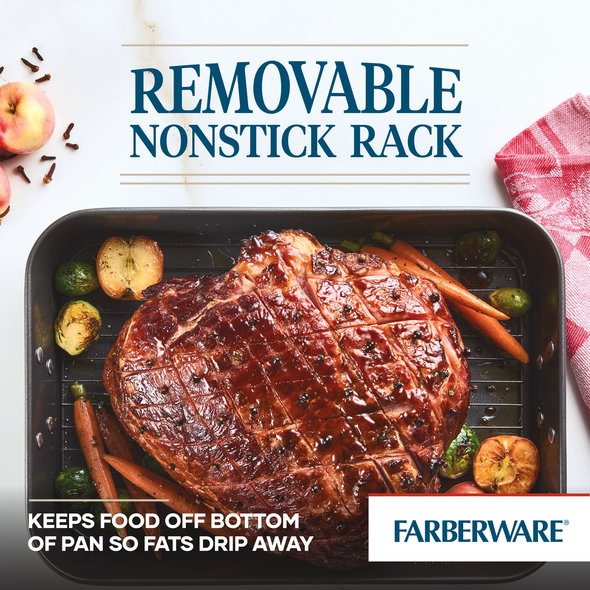 A cooked roast with vegetables on a pan with a nonstick removable rack.