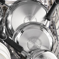 The 1-Quart Stainless Steel Saucepan, featuring a sleek design and black handle, sits neatly in the dishwasher, ready for everyday cooking.