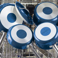 The 8-inch ceramic nonstick frying pan, known for its modern elegant design, is placed upside down in a dish rack for drying.