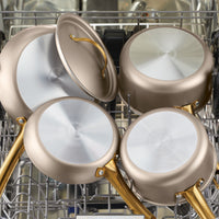 The 2.75-quart nonstick sauté pan with its lid rests gracefully in an open dishwasher, ensuring even heat distribution for your next culinary adventure.