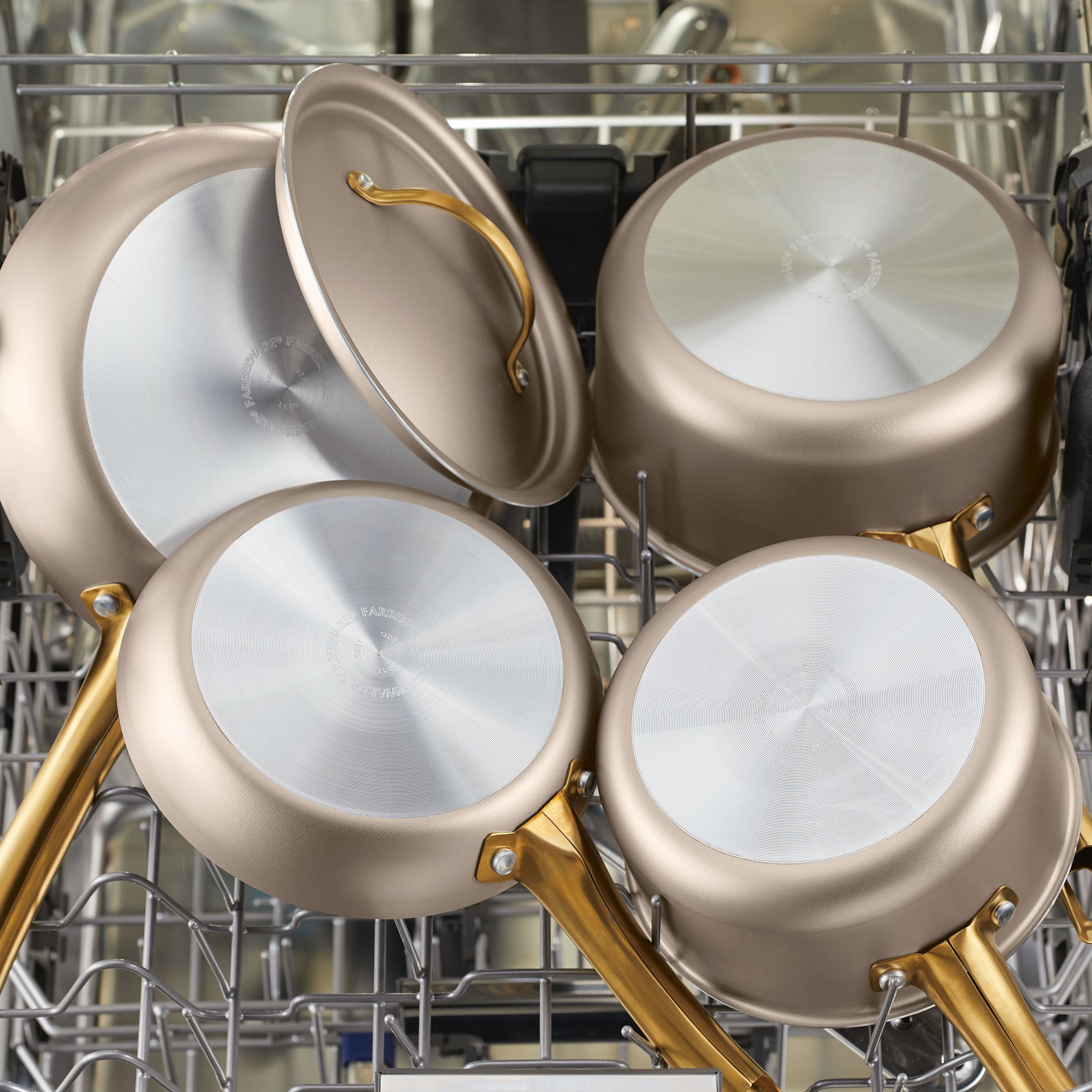 The 2.75-quart nonstick sauté pan with its lid rests gracefully in an open dishwasher, ensuring even heat distribution for your next culinary adventure.