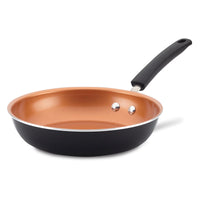 Copper-colored non-stick frying pan with a black handle.