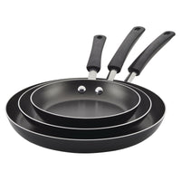 Three non-stick frying pans stacked, each with a black handle.