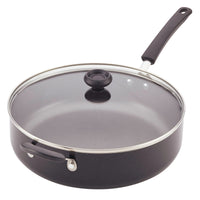 Nonstick skillet with a glass lid and black handle on a white background.
