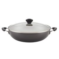 Black cooking pot with a glass lid and black handles on both sides.