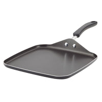 Black square griddle pan with a long handle on a white background.