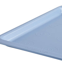 Blue rectangular baking tray with circular patterns, partial view.