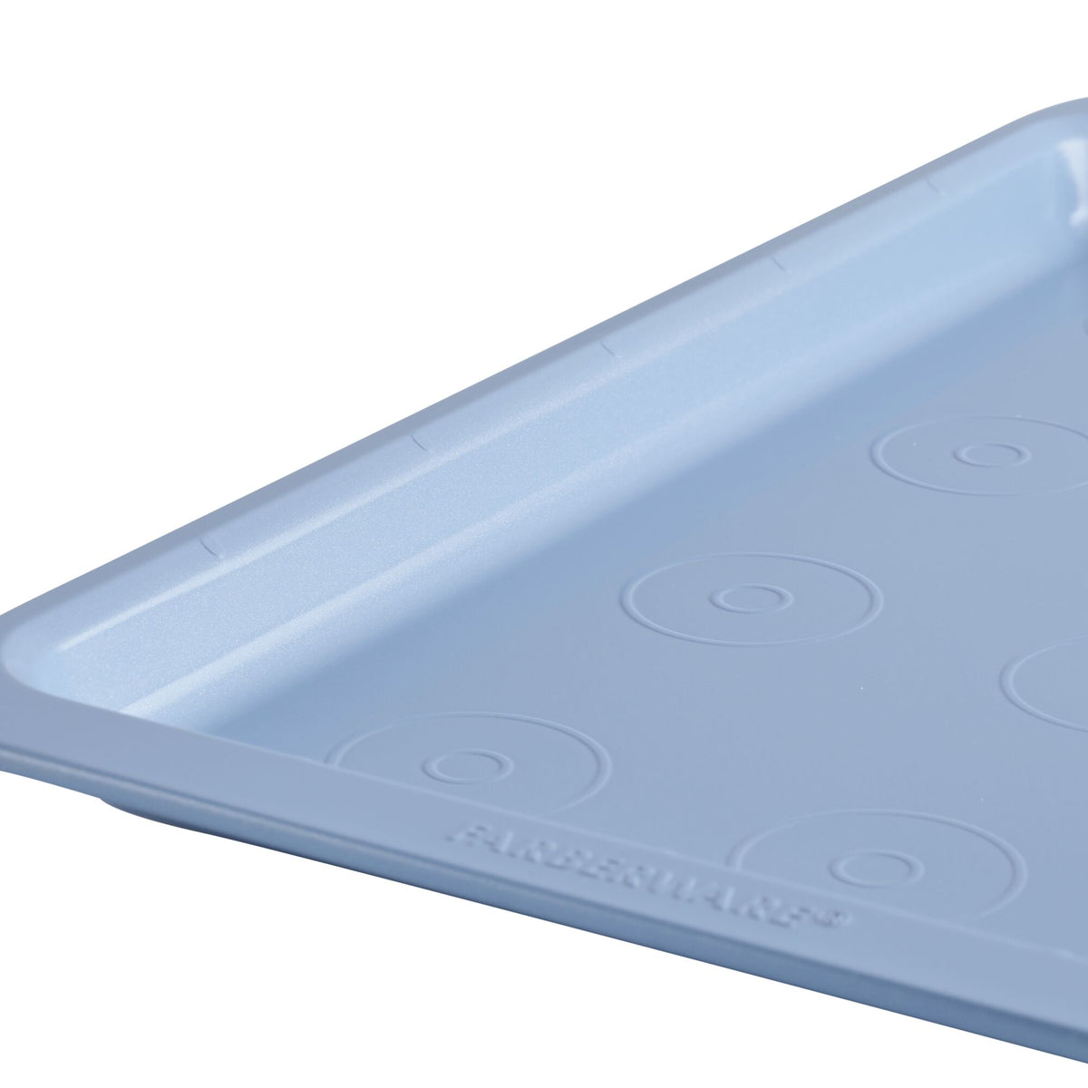 Blue rectangular baking tray with circular patterns, partial view.
