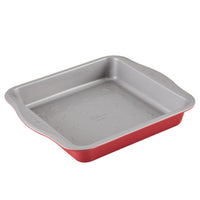 Red and gray square baking pan with handles on the sides.