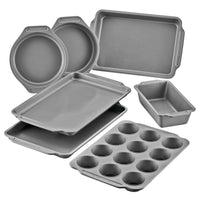 7-Piece Nonstick Bakeware Set: loaf, cake, sheet, and muffin trays.